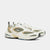 Pair of white and beige sneakers on a light gray background