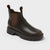 Brown leather boot with a thick sole on a light gray background