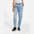 A model wearing a pair of light-wash blue high-waisted jeans with a straight-to-regular leg, paired with a white top and black platform shoes, shown from the waist down against a white studio background.