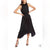 Woman wearing a black pleated dress on a white background