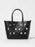 Black perforated handbag on a light gray background