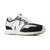 Black and white sneaker with New Balance logo on a white background