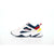A Nike sneaker in white, navy blue, red, and yellow, shown from the side profile against a plain white background.
