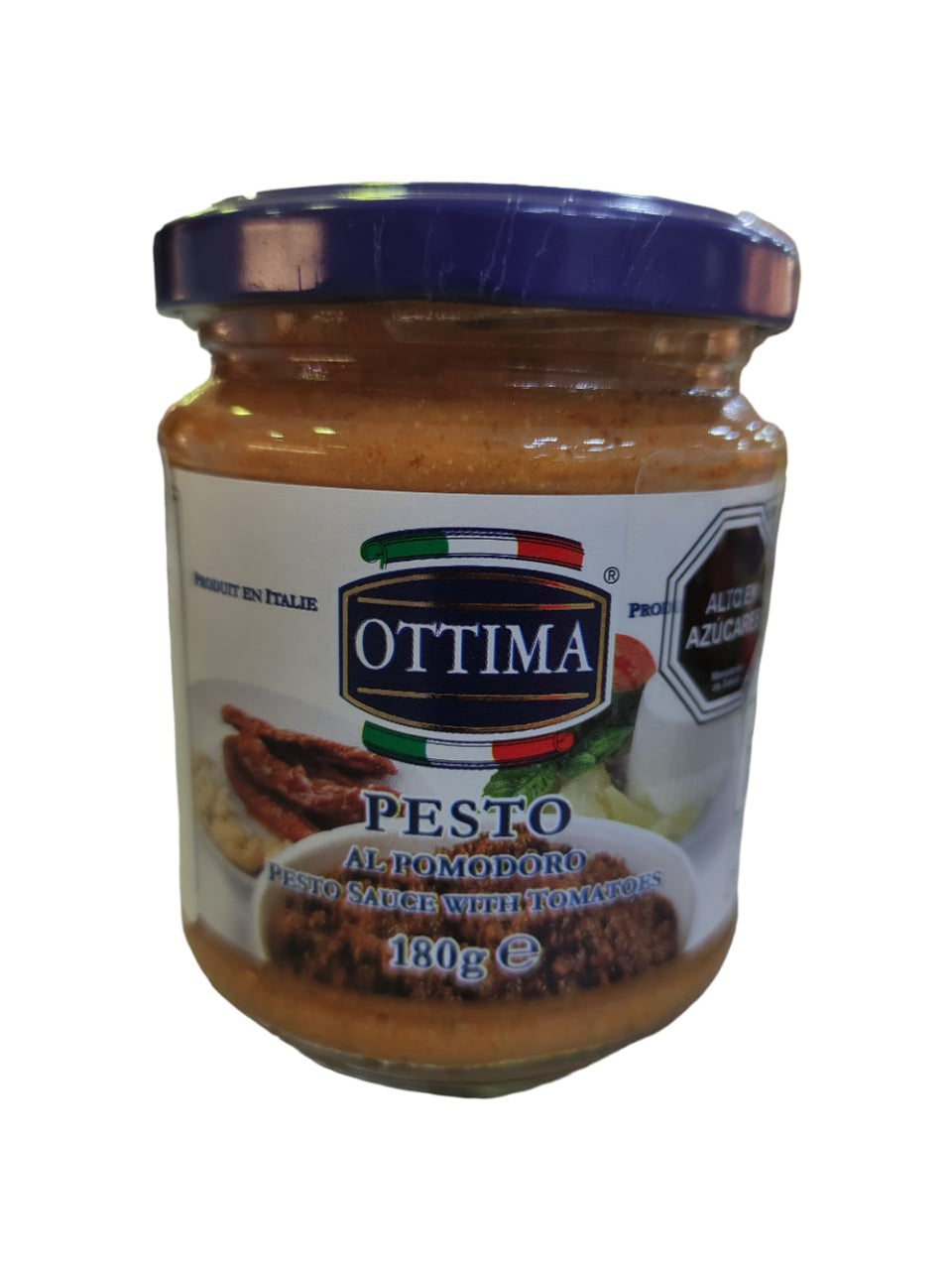 Jar of Ottima pesto sauce with a blue lid on a white background