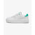 A white Puma platform sneaker with a vibrant mint green heel tab and matching green eyelets, shown in a side profile on a light gray background.