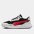 Black, red, and white sneaker with Puma logo on a light gray background