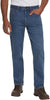 Person wearing blue jeans and brown shoes on a white background