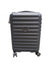 Black suitcase with wheels on a concrete floor in a warehouse setting