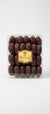 Packaged dates with a visible brand label on a light green surface