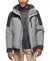 Man wearing a gray and black jacket with a white background