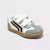 A low-top baby sneaker in white and gray suede with black side stripes, featuring two white hook-and-loop straps and a brown gum sole, shown on a light gray background.