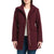 A woman wearing a burgundy wool-blend coat with a high collar, front zipper, and snap buttons, styled over a white top and blue jeans against a plain white background.