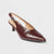 Brown leather slingback pump on a light gray background