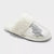 White slipper with rhinestone detail on a white background