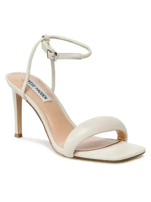 White sandal with 'Steve Madden' brand on a white background, featuring a discount banner.