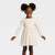 Cat & Jack Baby Girl's Beige Long Sleeve Sparkle Ribbed Tulle Dress | Cat & Jack In Lebanon