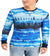 Person wearing a blue tie-dye long-sleeve shirt with a white background