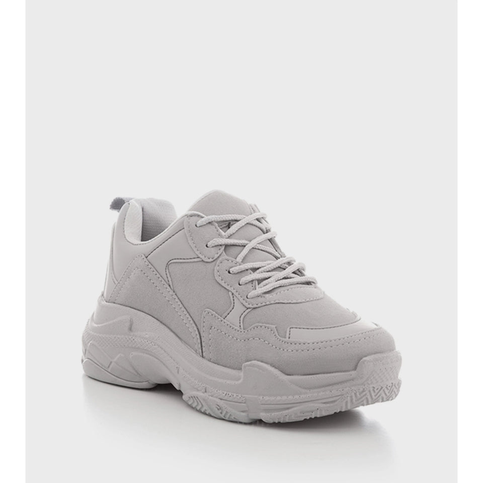 A light gray chunky sneaker with a thick textured sole, shown from a three-quarters angle on a light gray background.