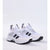 A pair of white athletic sneakers with black accents, featuring a mesh and synthetic upper, white laces, and a chunky white and black sole, set against a plain light gray background.