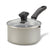 A stainless steel saucepan with a clear glass lid and black plastic handle, shown on a white background.