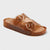 Brown jelly sandal with clear straps on a light gray background