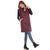 Woman wearing a burgundy quilted vest on a white background