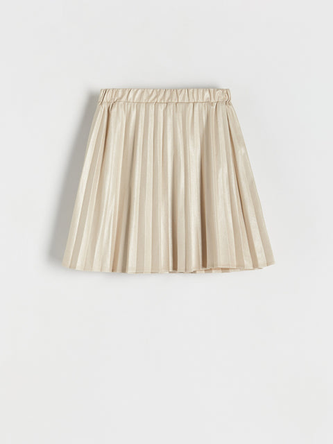Beige pleated skirt on a light gray background