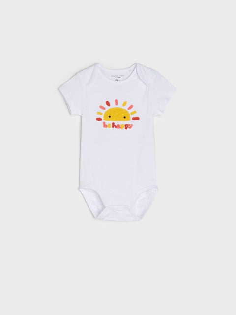 White baby onesie with a sun design and 'be happy' text on a white background
