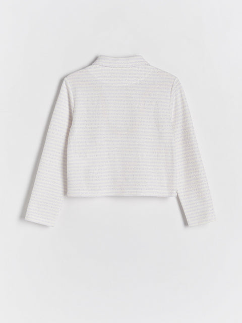 Striped long-sleeve top on a light gray background