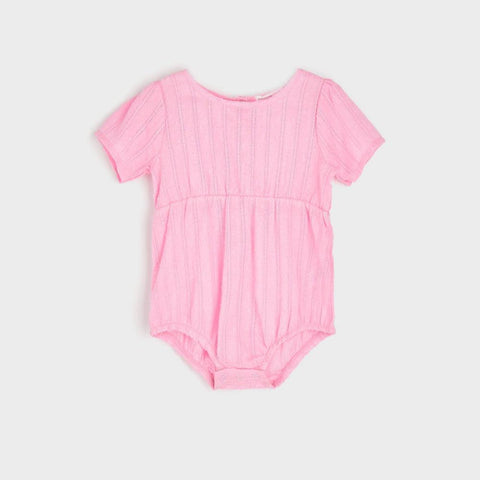 Pink baby bodysuit on a light gray background