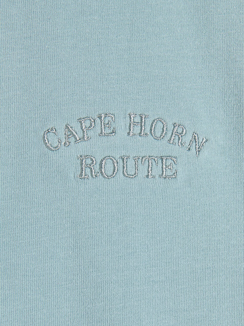 Text 'CAPE HORN ROUTE' embroidered on a light blue fabric background