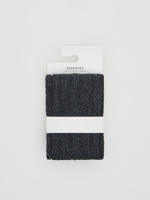 Pair of black and white socks on a white background with 'RESERVED' label.