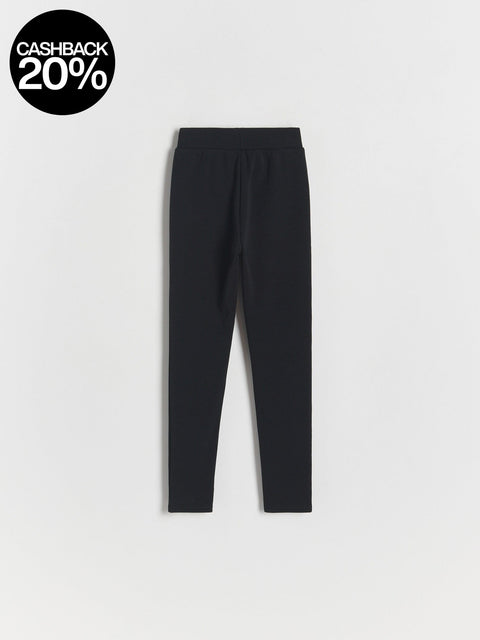 Black leggings on a light gray background