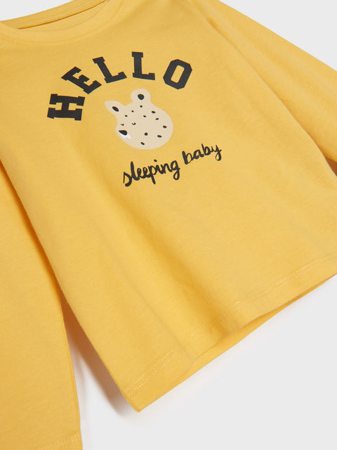 Yellow baby romper with 'HELLO sleeping baby' text and graphic on a white background
