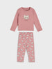 Pink pajama set with a bear design on the shirt and dog pattern on the pants against a light gray background.