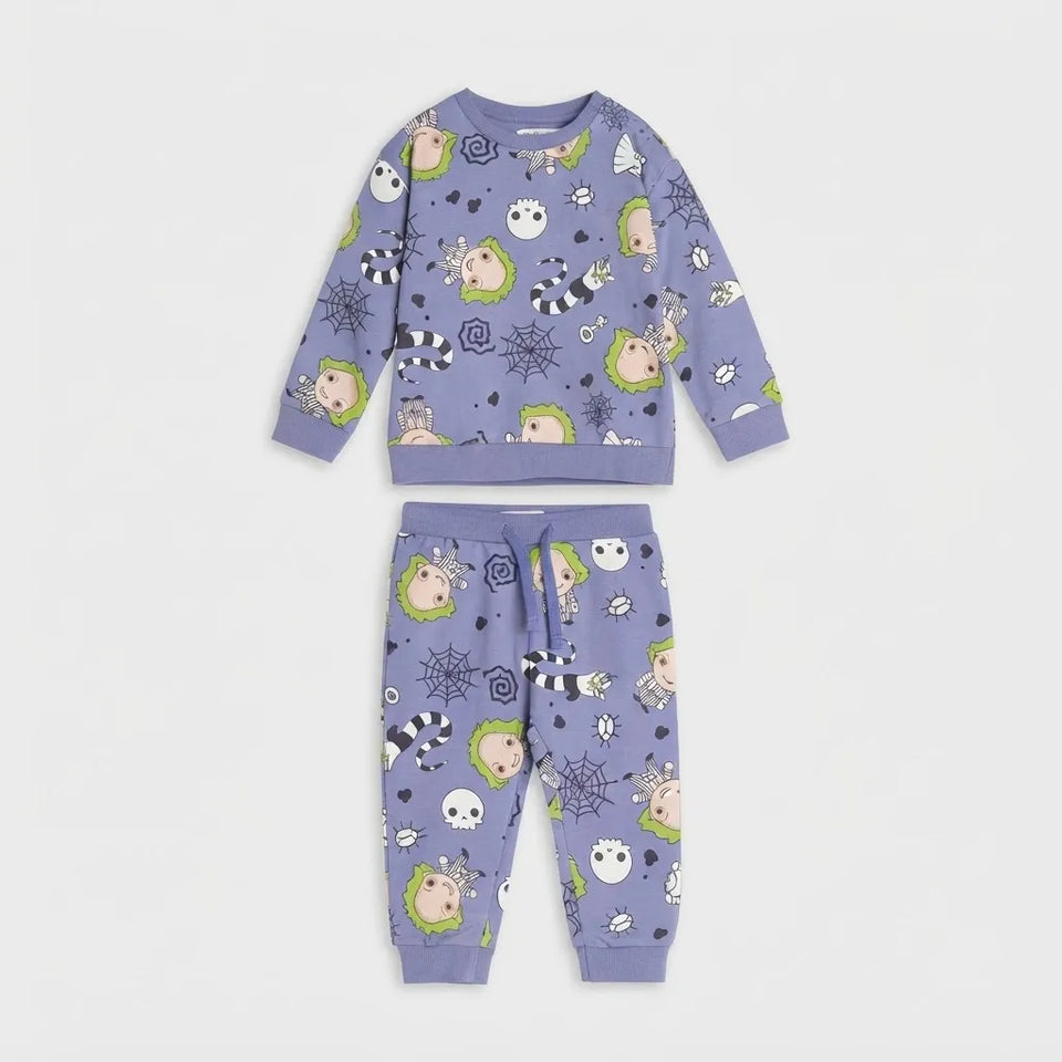 A two-piece children's pajama set in lavender purple, featuring a long-sleeve top and matching pants with a Halloween-themed cartoon print of ghosts, spiders, and pumpkins.