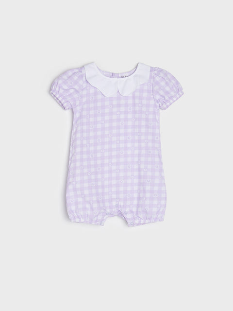 Baby romper with checkered pattern on a light gray background