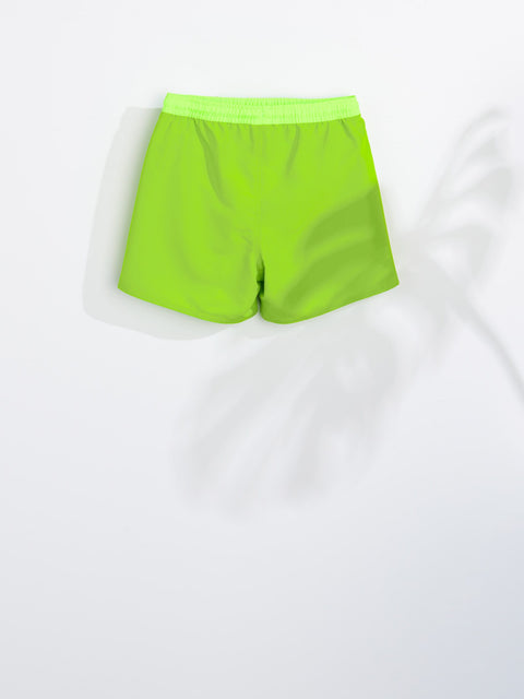 Neon green shorts on a white background
