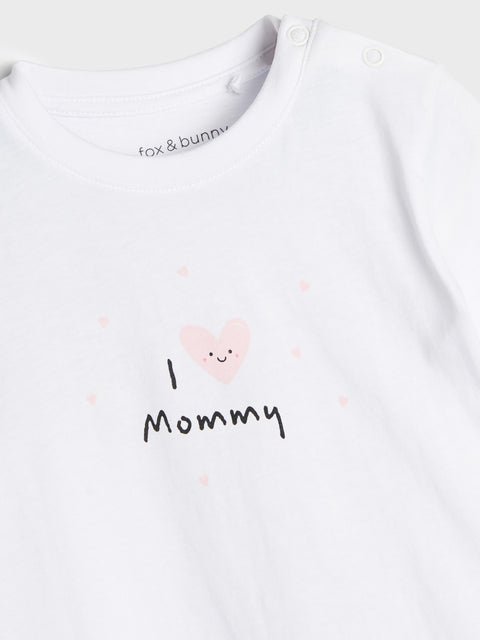 White baby onesie with 'I ❤️ Mommy' text and fox & bunny branding.