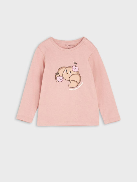 Pink long-sleeve shirt with a cartoon sloth design on a light gray background