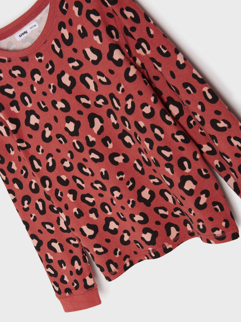 Red sweater with black leopard print on a white background