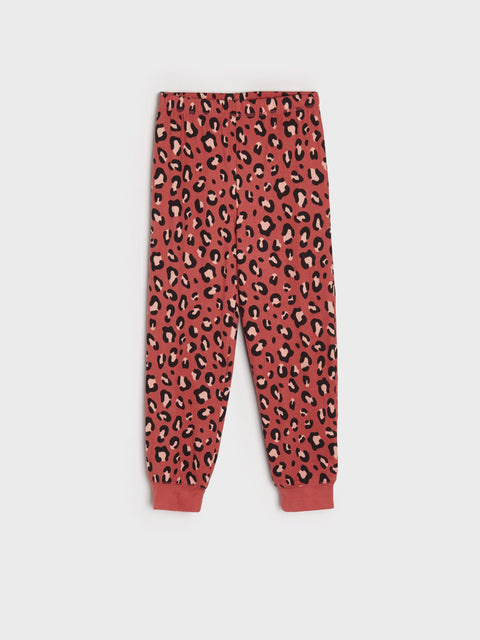 Red leopard print pants on a white background