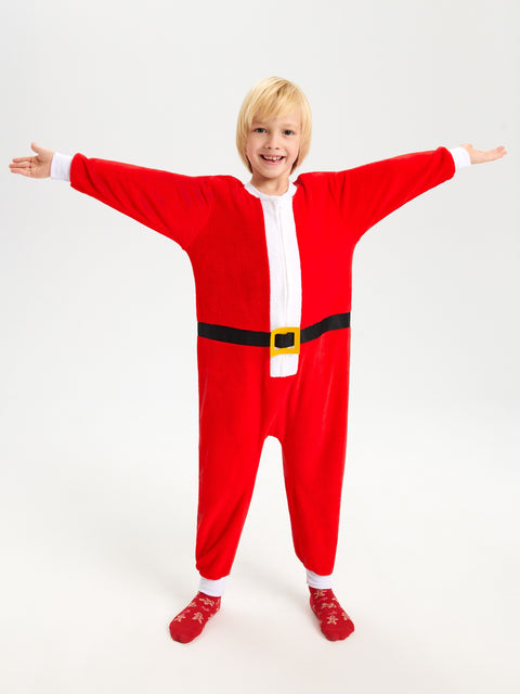 Child wearing a red Santa Claus onesie on a white background