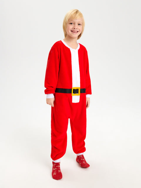 Child wearing a red Santa Claus onesie on a white background
