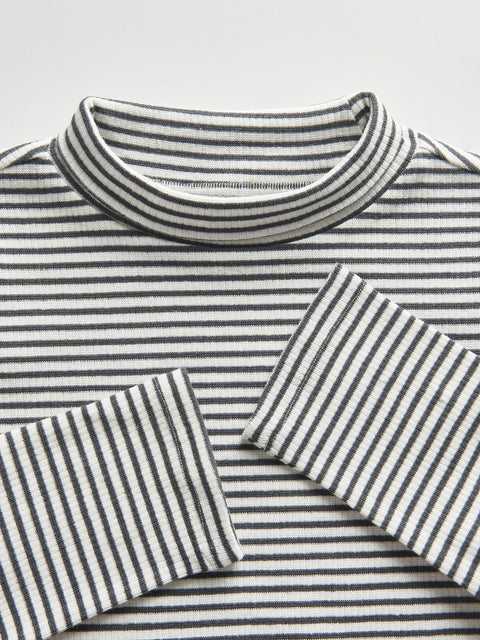 Close-up of a black and white striped shirt on a light gray background