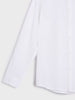 Close-up of a white shirt with a collar on a light gray background
