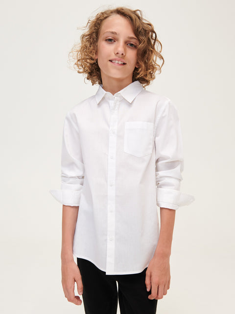 Person wearing a white shirt on a plain background