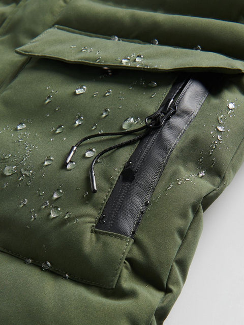 Green jacket with water droplets on a white background