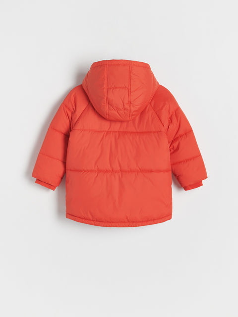 Orange puffer jacket on a light gray background