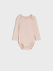 Pink baby bodysuit on a white background